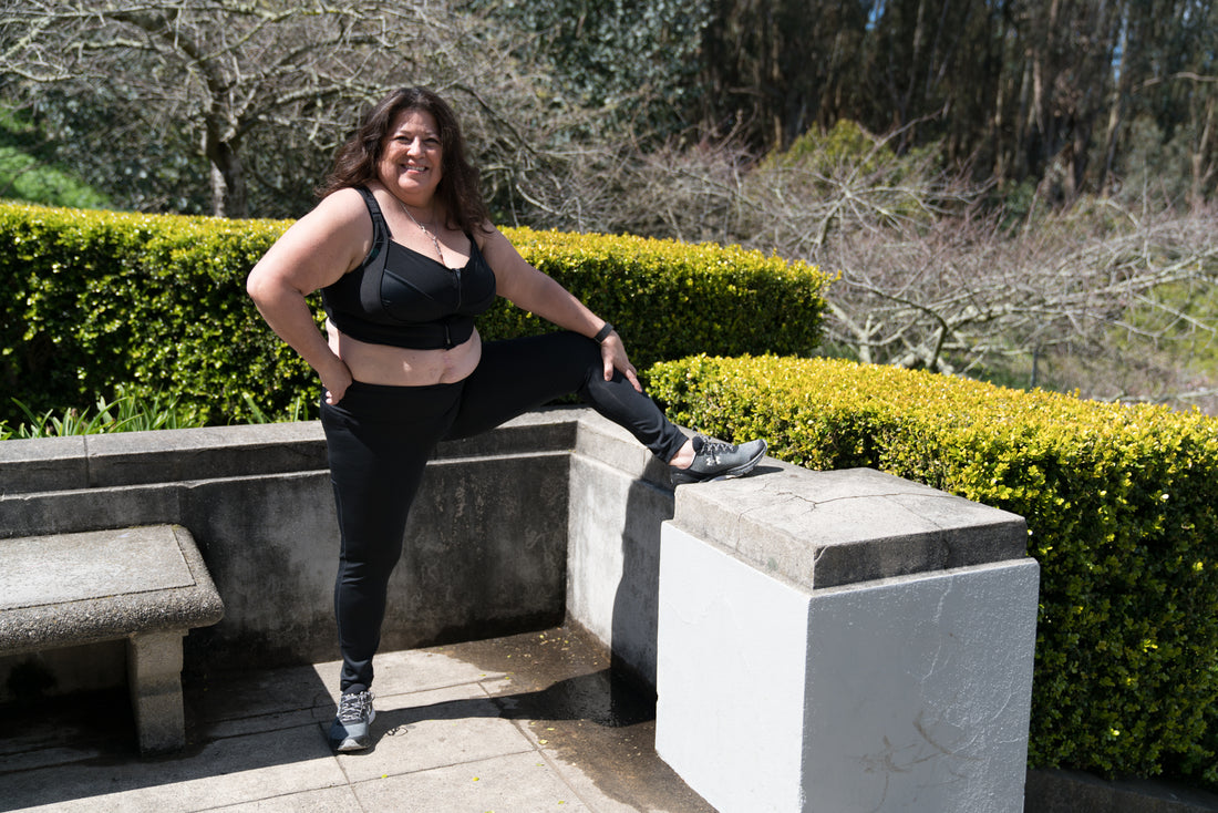 image of woman stretching in bloom bras sports bra