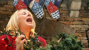 woman stressed surrounded by christmas decorations